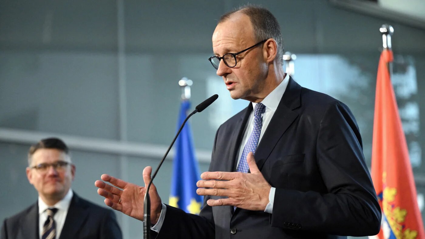 German Chancellor Friedrich Merz speaks at Deutsche Bank headquarters in Frankfurt am Main on 16 December 2025 during his inaugural visit to the German state of Hesse, as Premier Boris Rhein looks on (AFP)