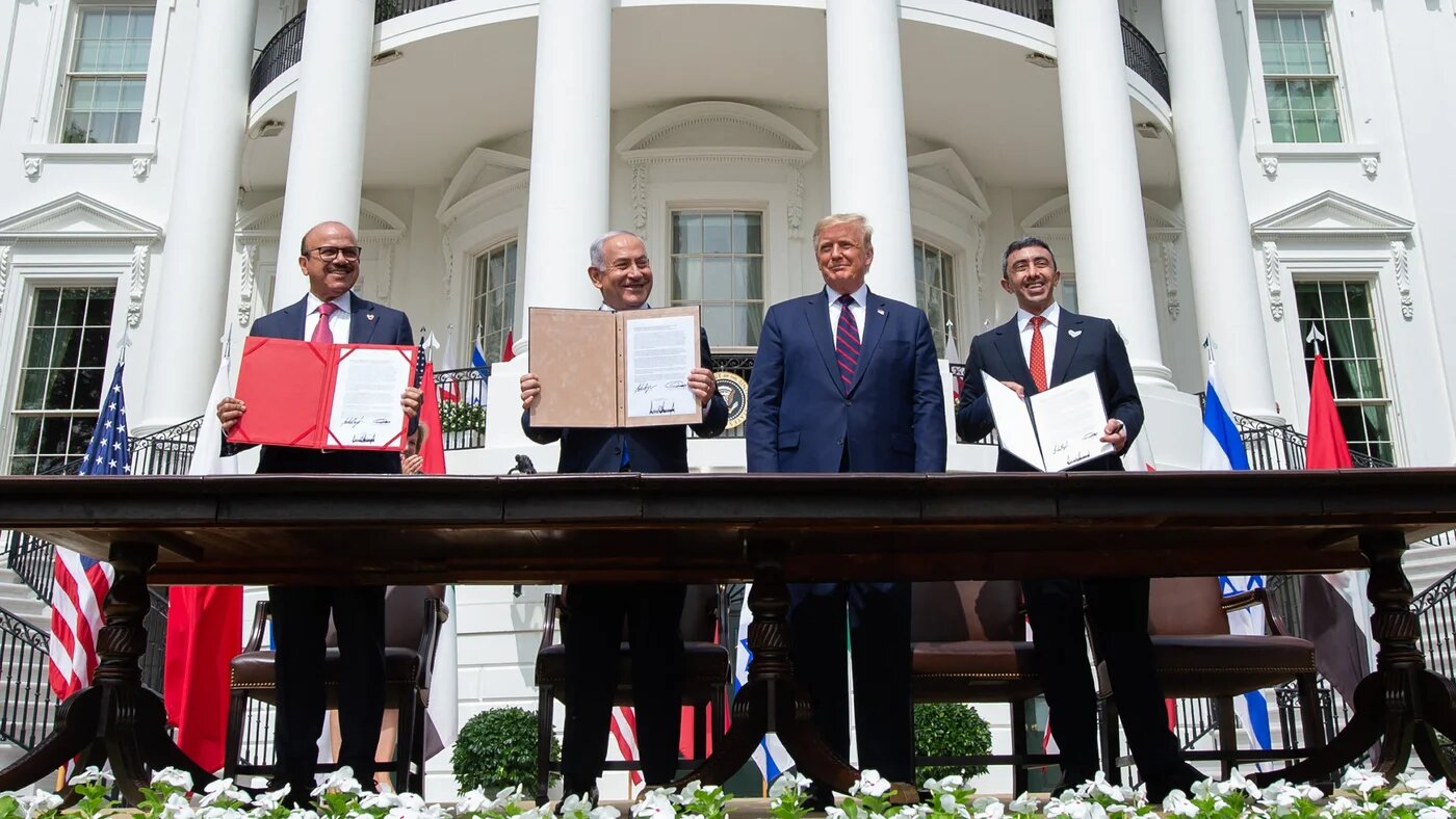 Bahraini Foreign Minister Abdullatif al-Zayani, Israeli Prime Minister Benjamin Netanyahu, US President Donald Trump and UAE Foreign Minister Abdullah bin Zayed after signing the Abraham Accords at the White House on 15 September 2020 (Saul Loeb/AFP)
