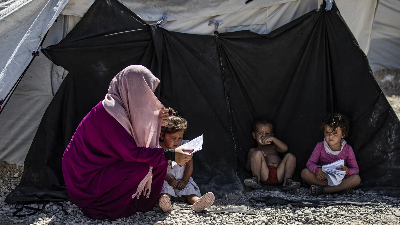 Woman and children in Camp Roj
