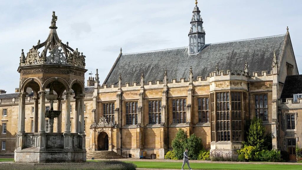 A fountain and the hall is pictured in Great Court at Trinity College, part of the University of Cambridge, in Cambridge, east England on October 14, 2020.