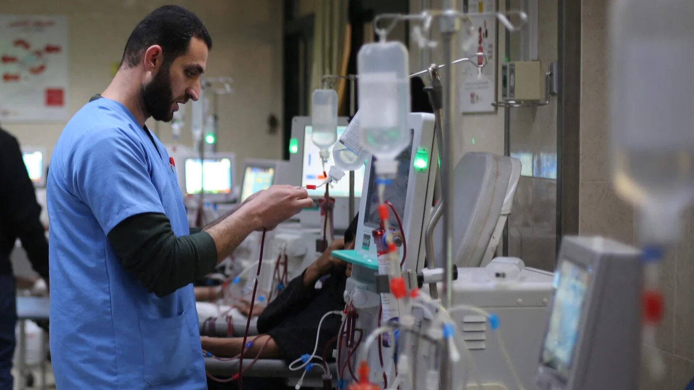 A doctor checks a drip at the dialysis unit of al-Aqsa Martyrs Hospital in Deir al-Balah, Gaza, on 1 February 2026