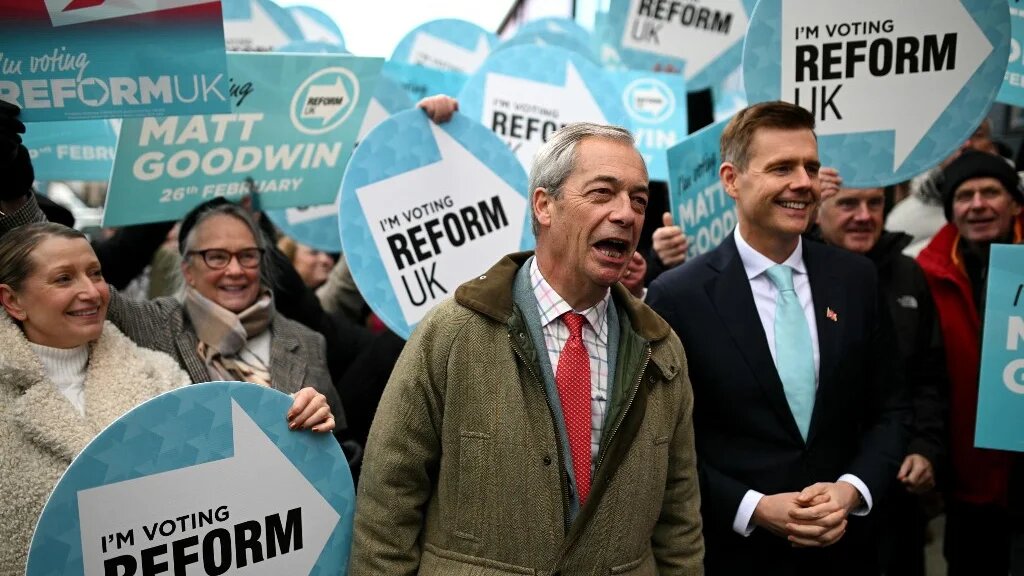 Matt Goodwin and Nigel Farage open the Gorton and Denton Reform UK campaign office, northwest England on February 5, 2026. (AFP)