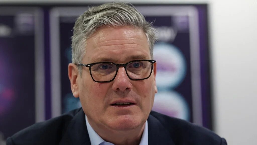 Britain's Prime Minister Keir Starmer meets with students during a visit to the Walbottle Academy Campus in Newcastle-upon-Tyne, northeast England on 26 February 2026 (AFP)