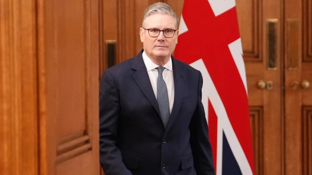 British Prime Minister Keir Starmer arrives in Downing Street, central London, to deliver a statement following the US and Israel's strikes on Iran on 28 February 2026 (AFP)
