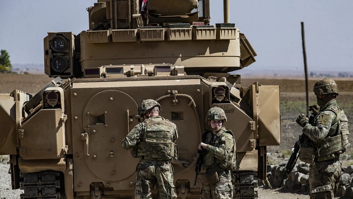 US soldiers patrol in the Syrian village of Jawadiyah