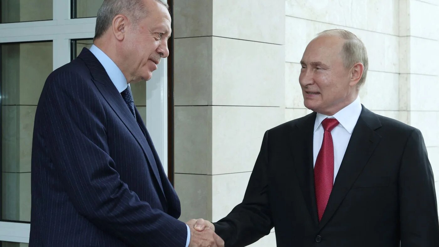A handout photograph taken and released on 29 September 2021 by the Turkish Presidential Press service shows Russian President Vladimir Putin (R) shaking hands with Turkish President Recep Tayyip Erdogan (L) after their meeting at the Russian Official Residence of Presidency in Sochi (AFP)
