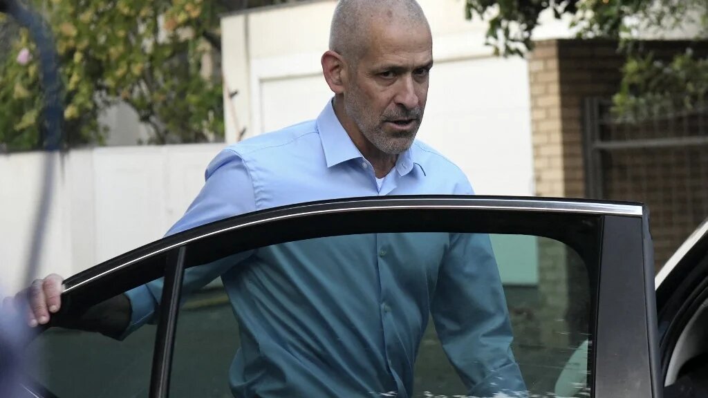 Ronen Bar, chief of the Israel Security Agency, also known as "Shin Bet", enters a vehicle at an undisclosed location in central Israel on 11 October 2021 (AFP)