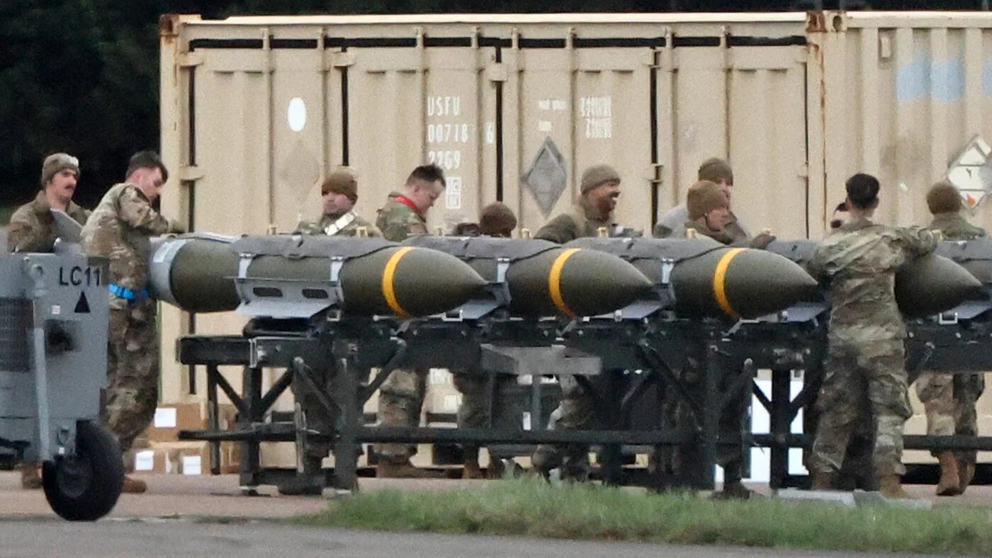 US Air Force personnel load munitions onto bombers at RAF Fairford in south-west England ahead of strikes on Iran on 10 March 2026 (Henry Nicholls/AFP)