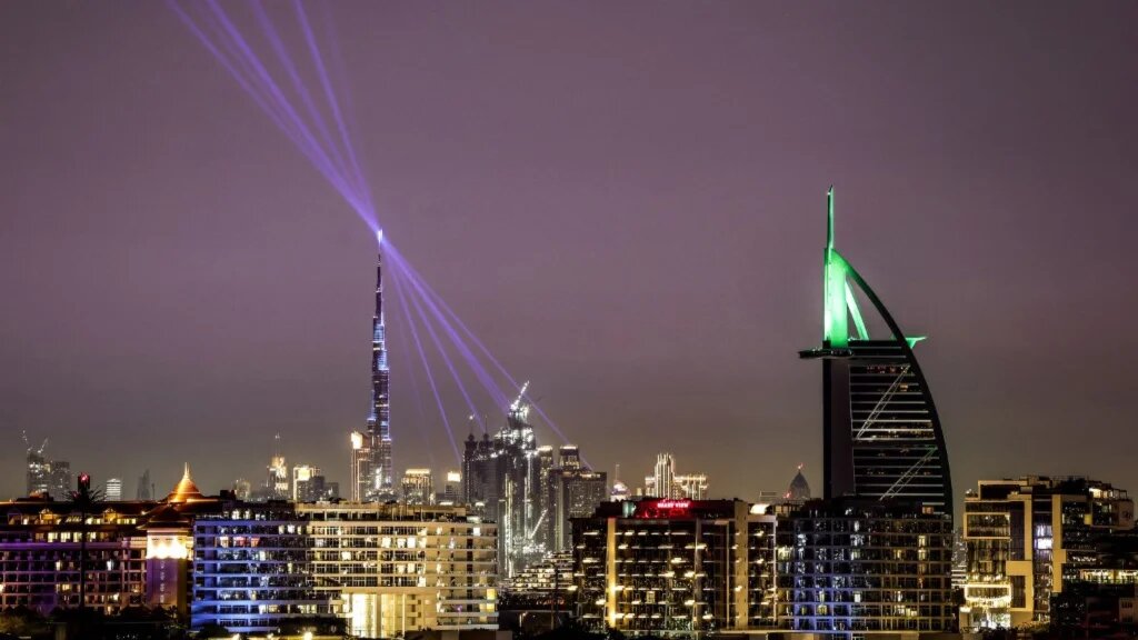 The Burj Khalifa skyscraper (L), the world’s tallest building, and the Burj al-Arab hotel (R) are pictured along the Dubai skyline on March 11, 2026. 