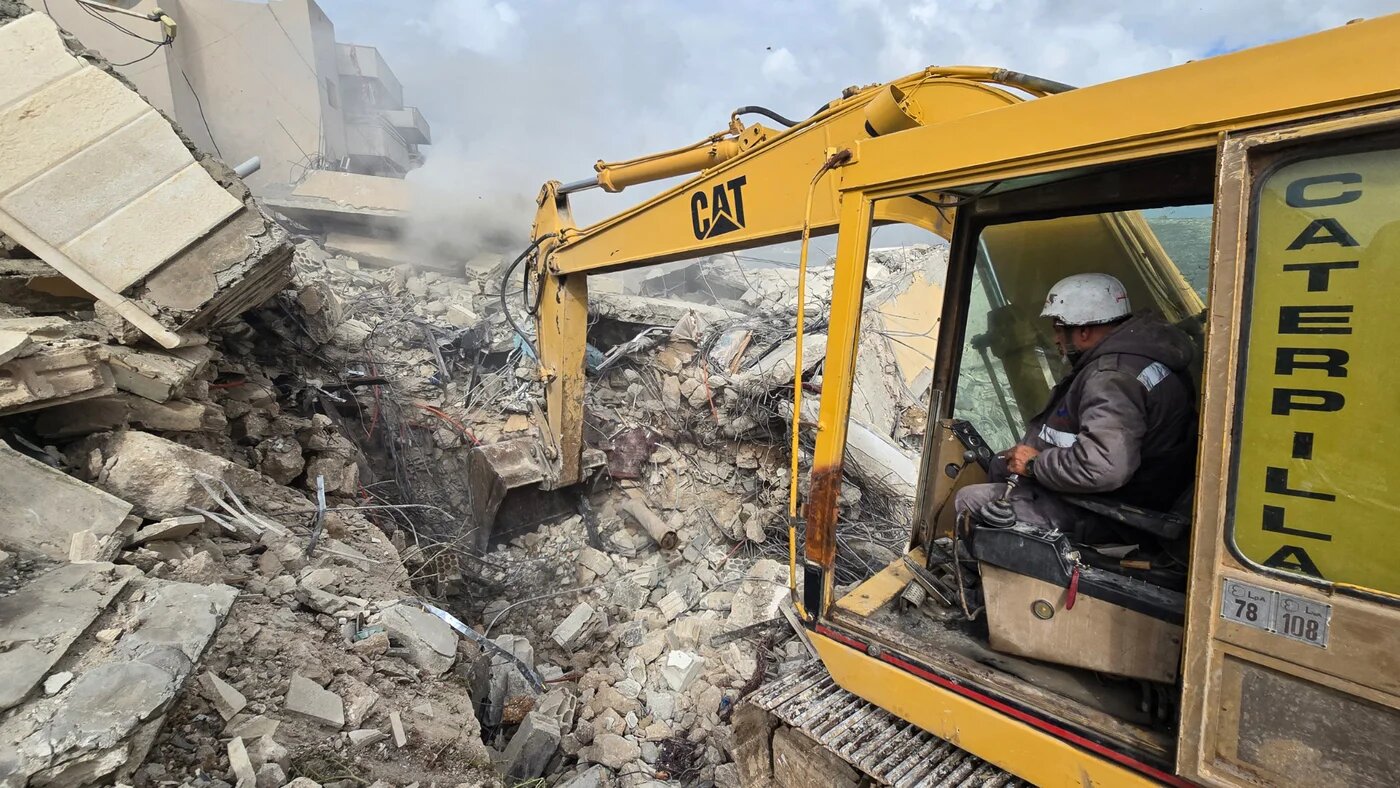 First responders work on the rubble of a building targeted by an Israeli airstrike in the southern Lebanese village of Hanouiyeh, east of Tyre, on 30 March 2026 (AFP/Kawnat Haju)