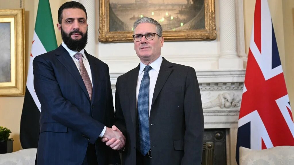 Syria's President Ahmed al-Sharaa is welcomed by Britain's Prime Minister Keir Starmer ahead of their meeting at 10 Downing Street in central London on 31 March 2026