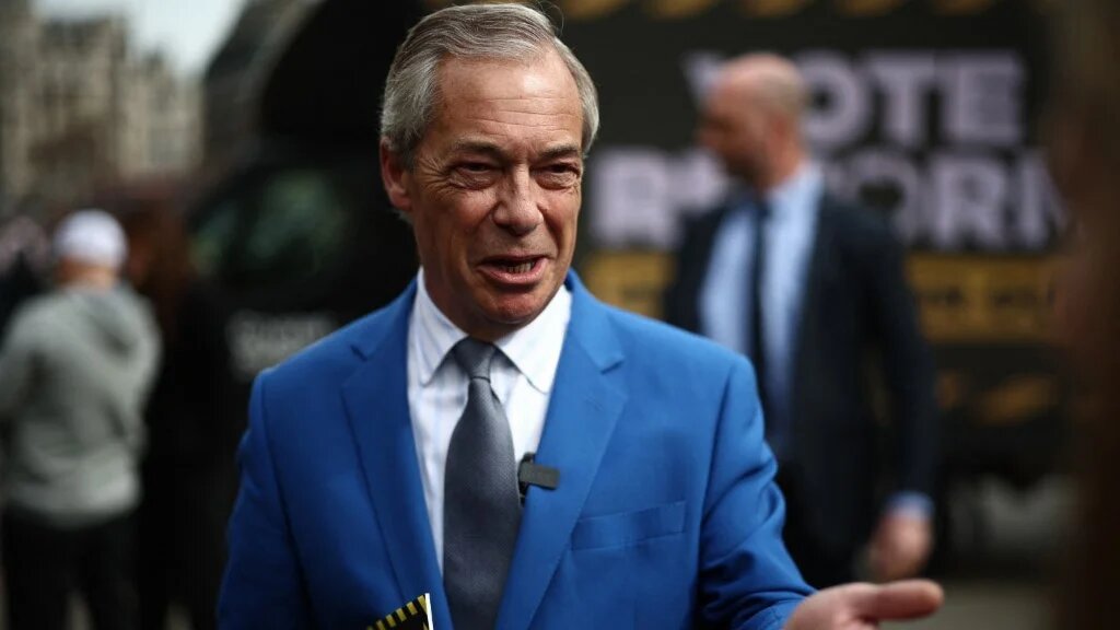 Reform UK leader Nigel Farage speaks to members of the media at a photo shoot to publicise a slogan ahead of the local elections in May, in central London on April 10, 2026.