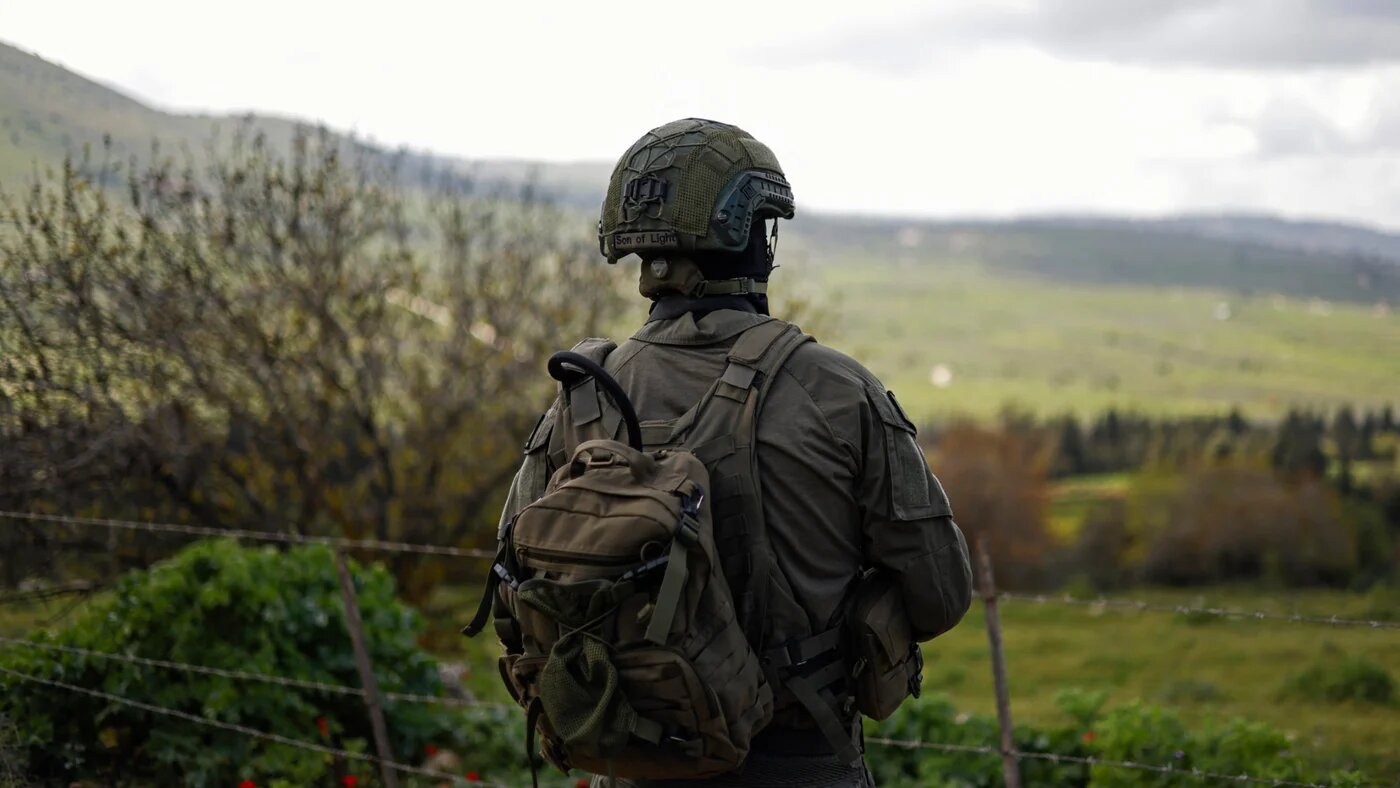 An Israeli soldier patrols along the Israel-Lebanon boundary on 10 April 2026 (Jalaa Marey/AFP)