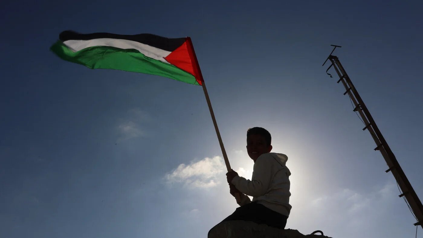 A boy waves a Palestinian flag during a solidarity rally in support of the Global Sumud Flotilla in Gaza City on 30 April 2026 (Omar Al-Qattaa/AFP)