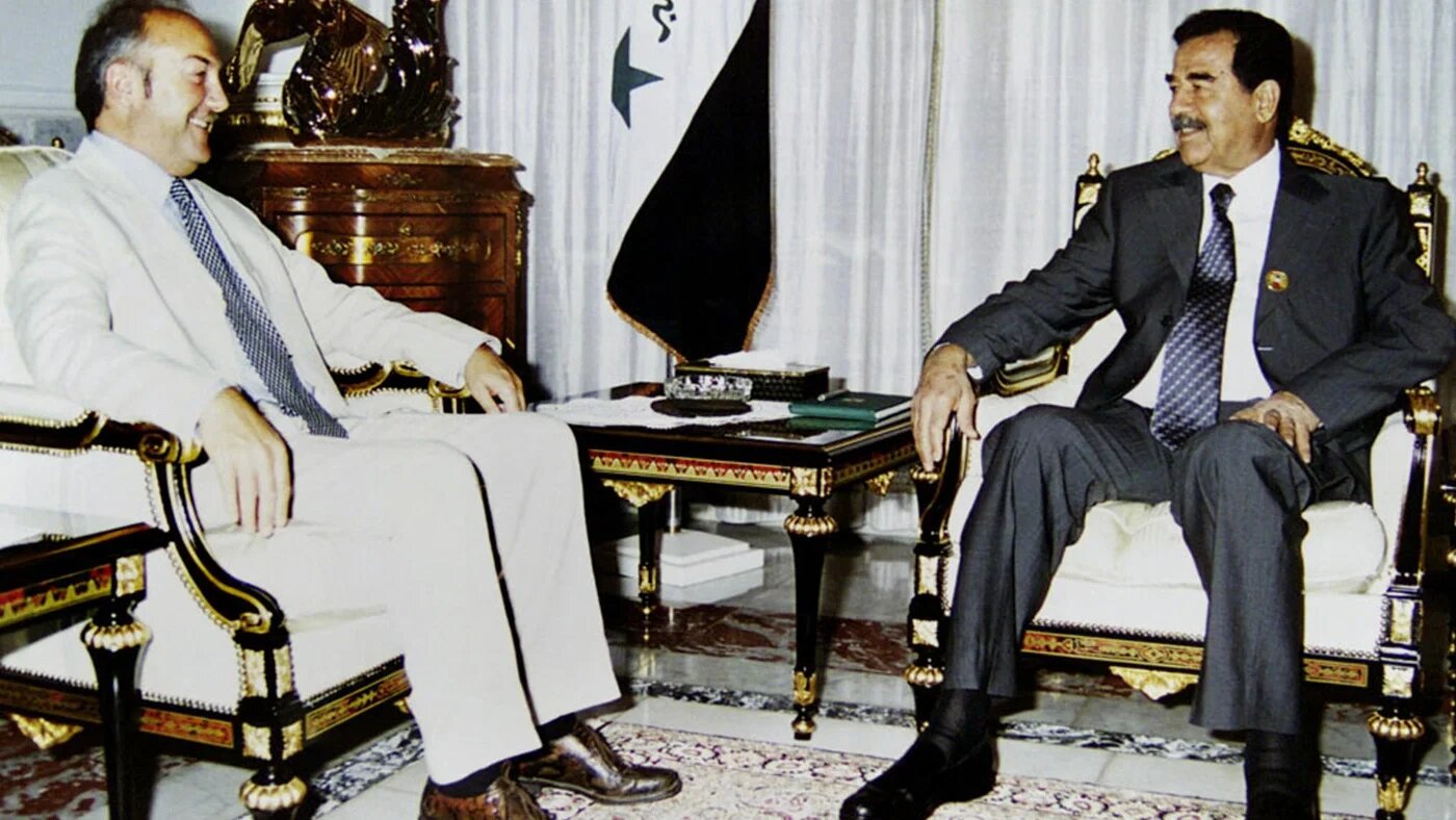 President Saddam Hussein (R) meeting with British Labour MP George Galloway on 8 August 2002 in Baghdad, Iraq (AFP/INA)