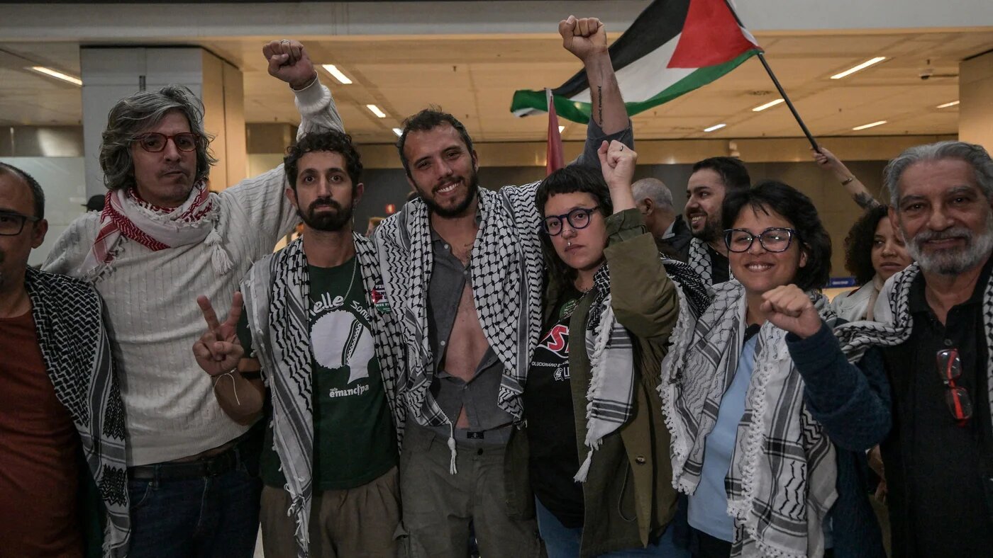 Brazilian activist Thiago Avila, a member of the Global Sumud Flotilla, is greeted on arrival at Sao Paulo Guarulhos International Airport in Brazil on 11 May 2026 (Nelson Almeida/AFP)