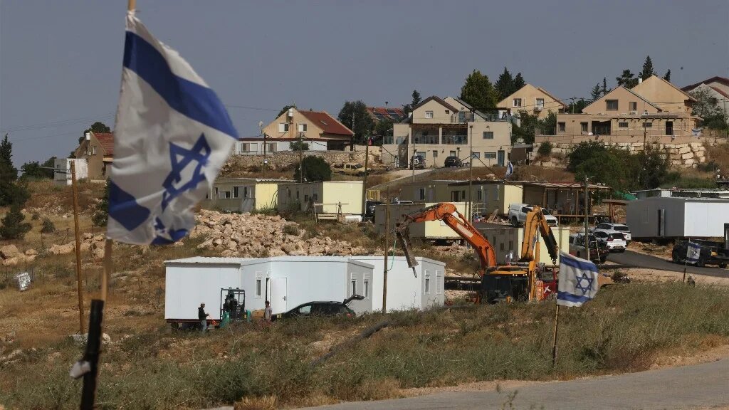 New homes along a road that heads toward the Palestinian village of Umm al-Khair, in the southern area of the Israeli-occupied Palestinian West Bank on 20 May (AFP)