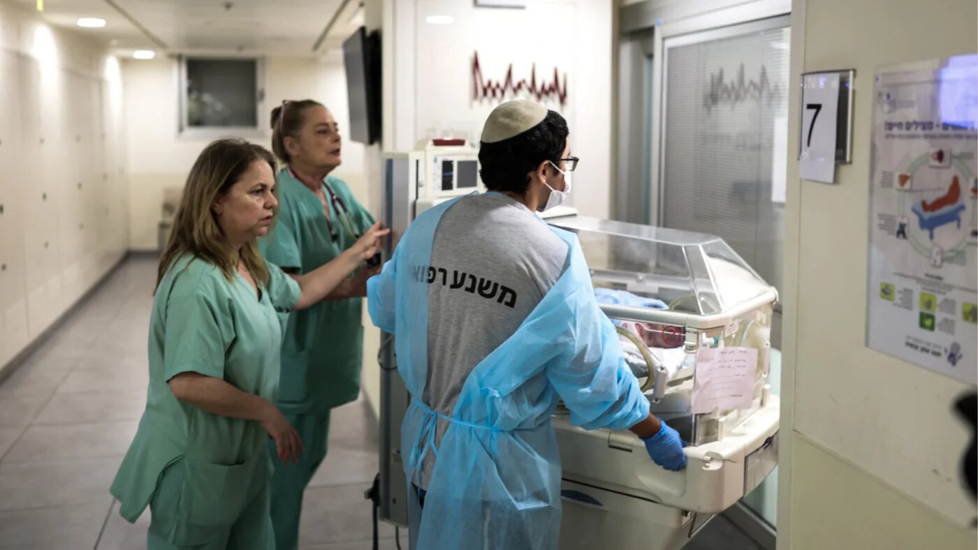 Hospital staff move a baby in an incubator to an underground facility for safety in Tel Aviv on 8 June 2026, after sirens sounded following Iranian attacks (Ilia Yefimovich/AFP)