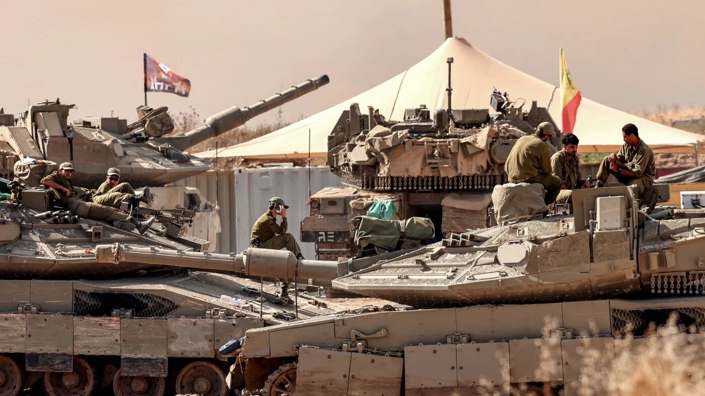 Israeli tanks and troops deployed by the boundary with Gaza on 10 June 2026 (Jack Guez/AFP)