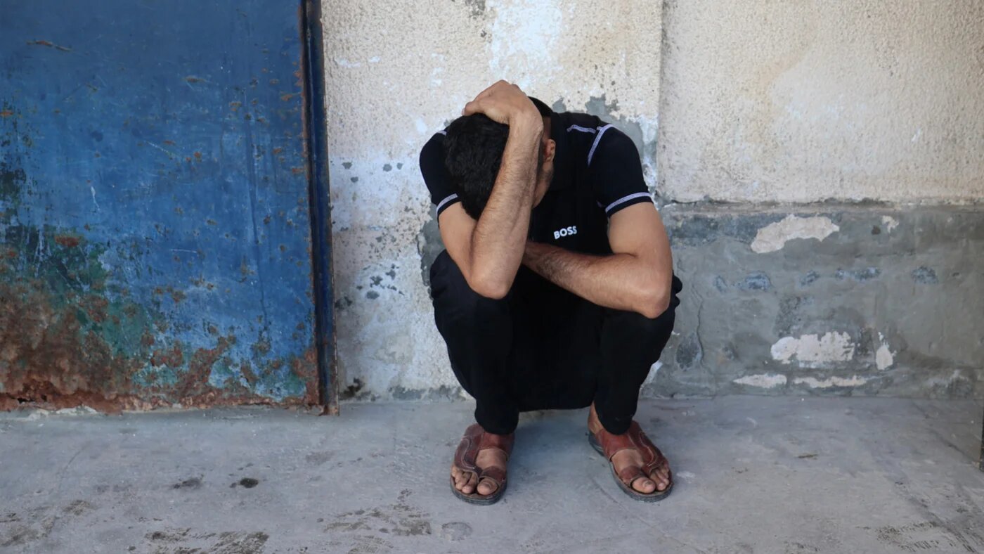 A Palestinian mourns the death of Al Jazeera  journalist Ahmed Wishah, who was killed in an Israeli strike, at Al-Aqsa Martyrs Hospital in Deir el-Balah in the central Gaza Strip in 21 June 2026 (Eyad Baba/AFP)