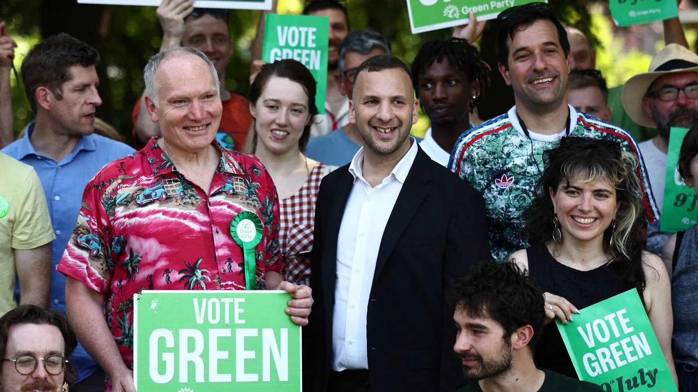 Britain's leader of the Green Party, Zack Polanski poses with supporters after speaking at a rally in a park in south London, on June 24, 2026.