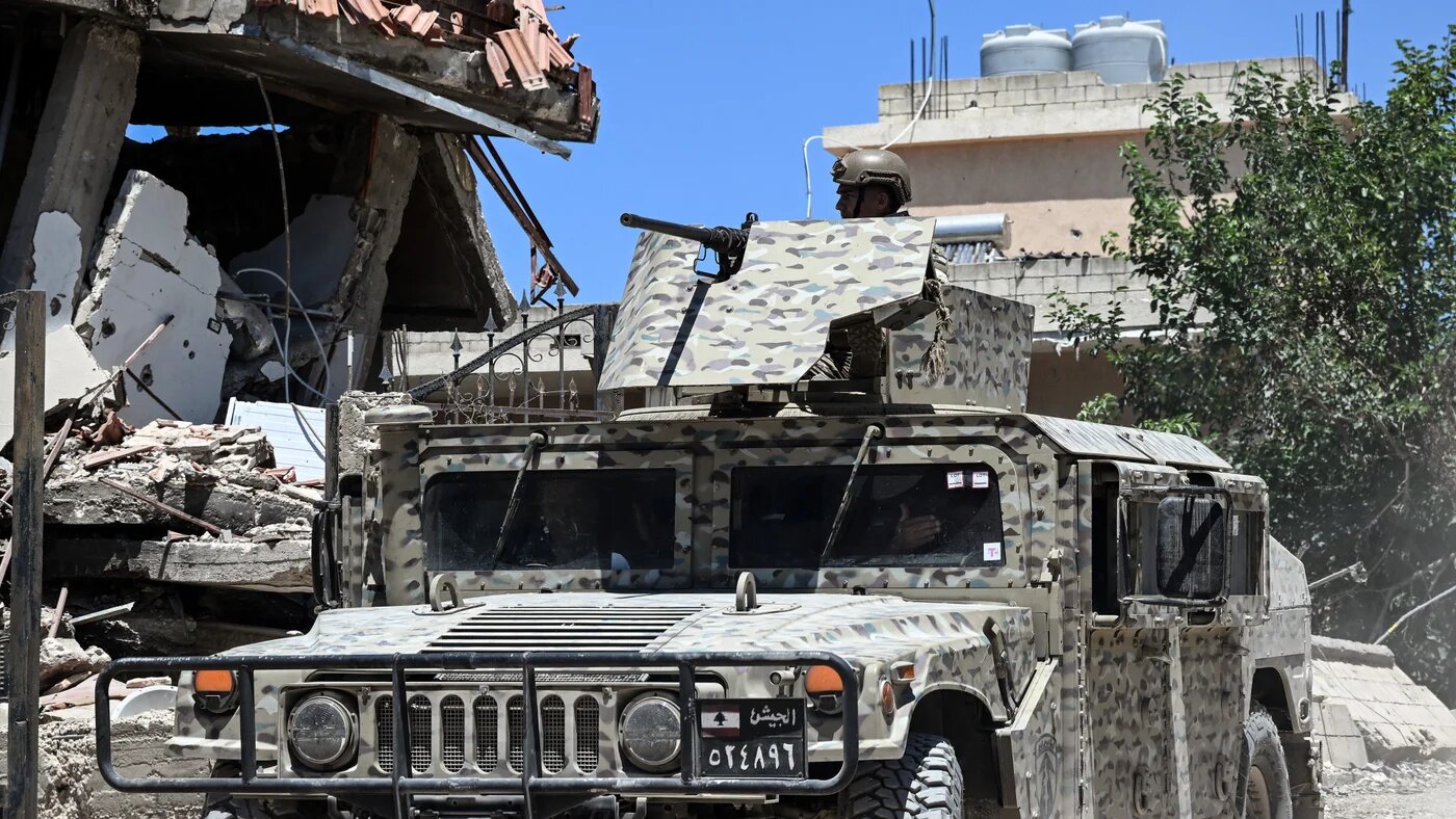 Lebanese soldiers patrol Zawtar al-Gharbiya on 28 July 2026, as residents return to inspect their homes a week after the army deployed to the southern village under the US-sponsored 'pilot zones' agreement (Joseph Eid/AFP)