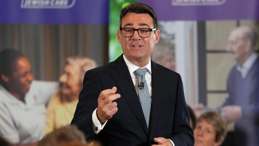 British Prime Minister Andy Burnham delivers a speech as he visits social care organisation Jewish Care in London on 29 July (AFP)