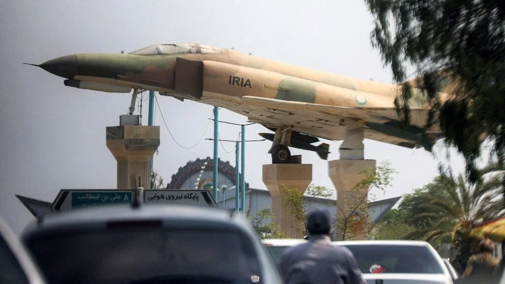 A replica of an Iranian air force F-4 Phantom fighter aircraft is displayed in a city square in Bandar Abbas in southern Iran on 10 August (AFP/Atta Kenare)