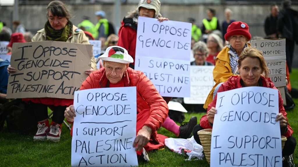 Supporters of the proscribed group Palestine Action gather to protest outside the conference venue on the first day of the annual Labour Party conference in Liverpool, north-west England, on September 27, 2026. 