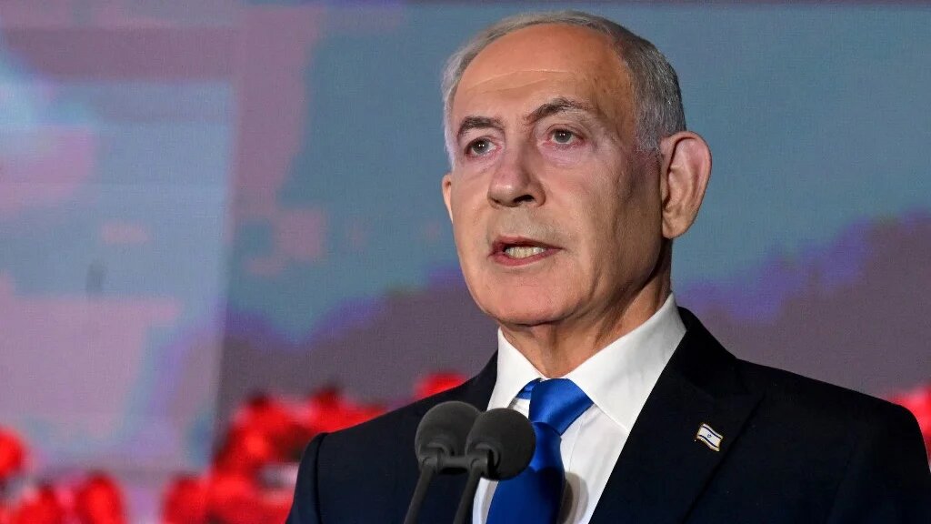 Israeli Prime Minister Benjamin Netanyahu speaks during the state memorial ceremony for the third anniversary of the 7 October attack, at Mount Herzl military cemetery in Jerusalem on 5 October (AFP)
