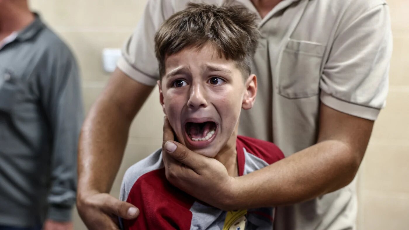 One of the sons of Palestinian man Ali al-Bazzari mourns during his father's funeral at Rafidia Hospital in the occupied West Bank city of Nablus after the latter was reportedly killed during an Israeli settler and army raid in the village of Burqa on 7 October 2026 (Zain Jaafar/AFP)