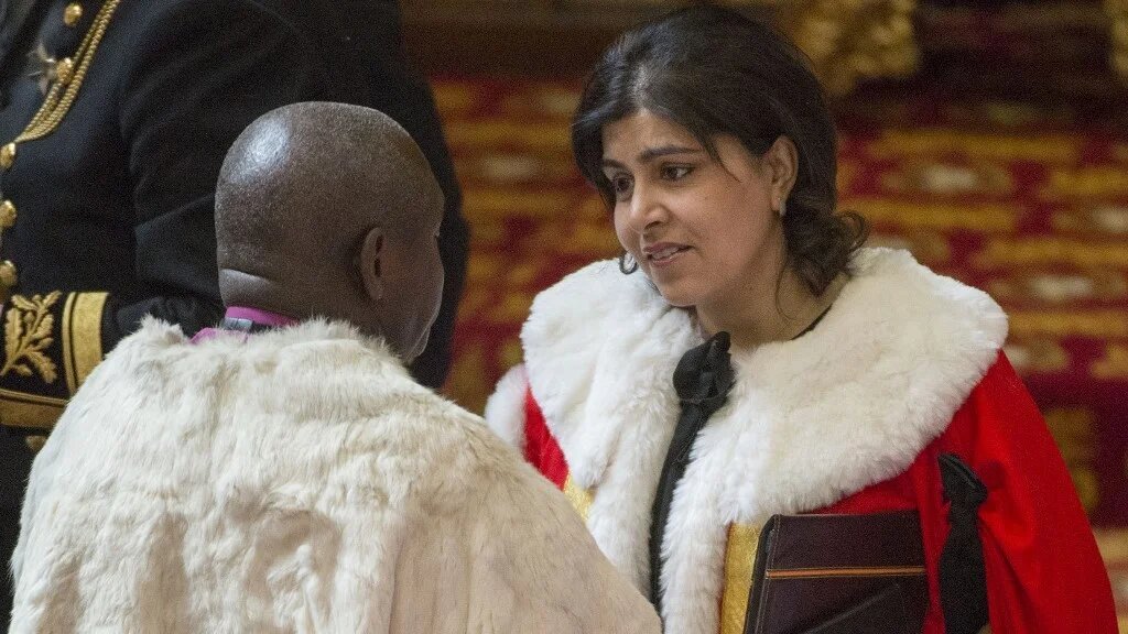 Baroness Sayeeda Warsi (R) attends the State Opening of Parliament at the Palace of Westminster in London on 27 May 2015