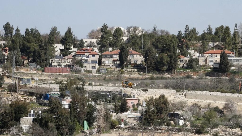 A picture taken from the Israeli-occupied West Bank city of Hebron shows the Israeli Gush Etzion settlement bloc on 5 March 2017 (AFP)