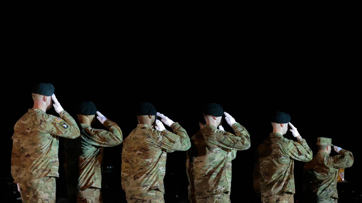 A US Army carry team salutes the remains of Army Sergeant Benjamin N Pennington at Dover Air Force Base in Dover, Delaware, 9 March 2026 (Chip Somodevilla/Getty Images via AFP)