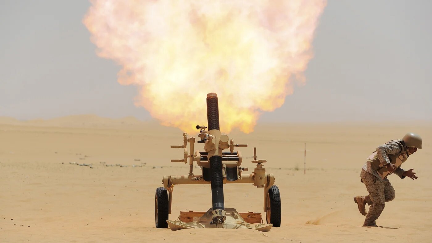 A Saudi soldier fires a mortar towards Houthi movement position, at the Saudi border with Yemen (Reuters)