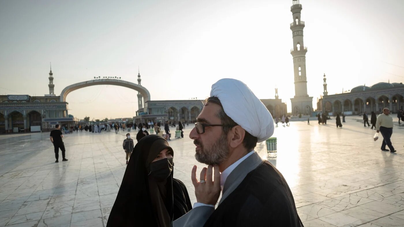 An Iranian woman receives religious advice from a cleric in the holy city of Qom (Reuters)