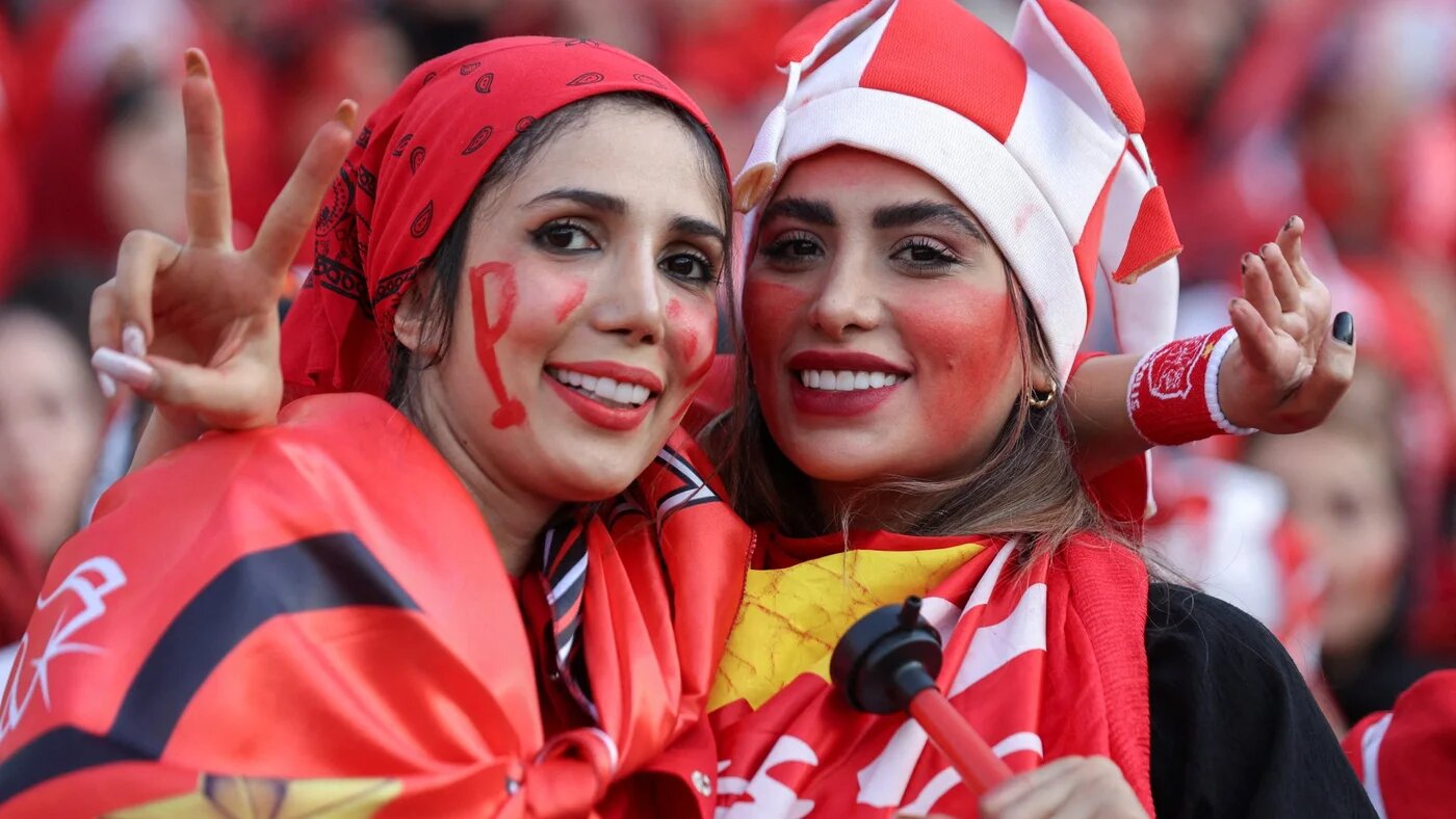 Iranian women attend a match between Persepolis and Sanat Naft-e Abadan teams at Azadi stadium in Tehran, 31 August (Reuters)