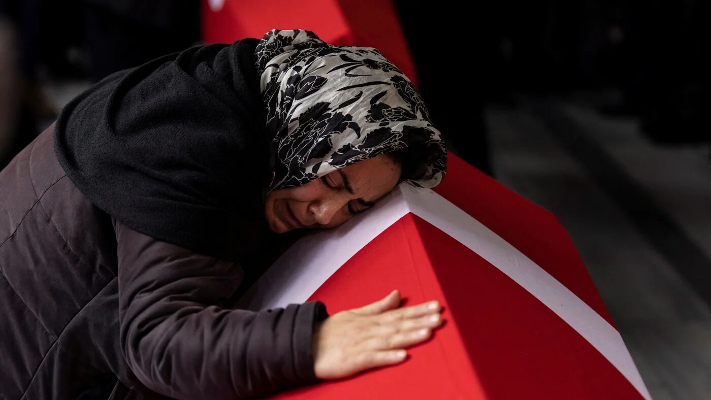 A relative of two victims of Sunday's blast mourns during their funeral ceremony in Istanbul (Reuters)