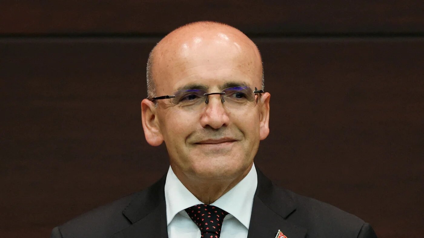 Treasury and Finance Minister Mehmet Simsek looks on during a news conference where Turkish President Recep Tayyip Erdogan announced the new cabinet, in Ankara, 3 June (Reuters)