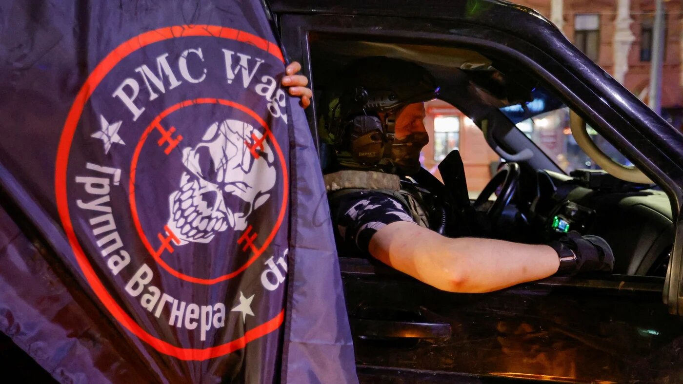Fighters of Wagner private mercenary group pull out of the headquarters of the Southern Military District to return to base, in the city of Rostov-on-Don, Russia, 24 June (Reuters)