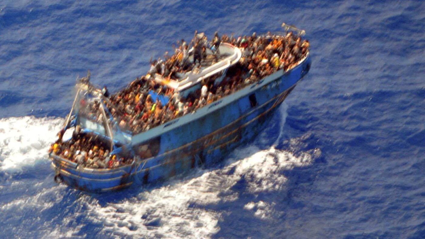 An undated photo shows people onboard a boat during a rescue operation, before their boat capsized on the open sea, off Greece on 14 June 2023 (Reuters)