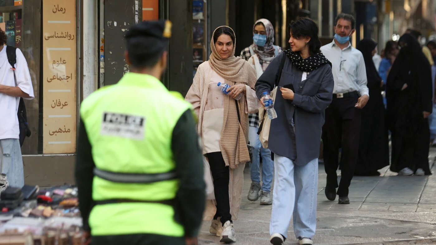 Iranian women walk on a street during the revival of morality police in Tehran, Iran, on 16 July 2023 (West Asia News Agency via Reuters)