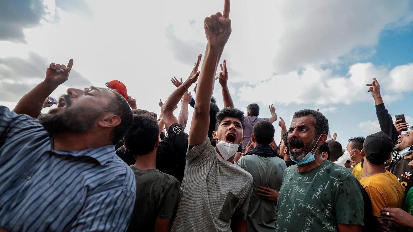 People protest outside the Al Sahaba mosque against the government in Derna, Libya 18 September 2023 (Reuters)