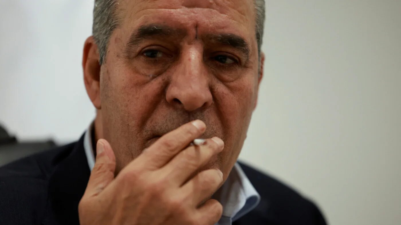 Hussein al-Sheikh is pictured during an interview with Reuters in Ramallah, in the occupied West Bank, on 16 December 2023 (Reuters/Ammar Awad)