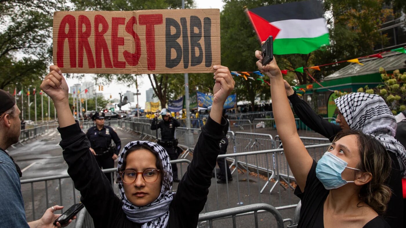 A pro-Palestinian demonstrator shows a sign with the words ''Arrest Bibi'' during a protest in front of the United Nations (UN) headquarters in New York City, USA, on 26 September 2024 (Aashish Kiphayet via Reuters)