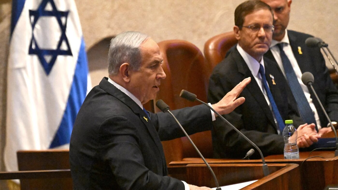 Israeli Prime Minister Benjamin Netanyahu speaks at the opening of the 25th Knesset session marking the anniversary of the “Iron Swords” war in Jerusalem, 28 October 2024 (Debbie Hill/Reuters)