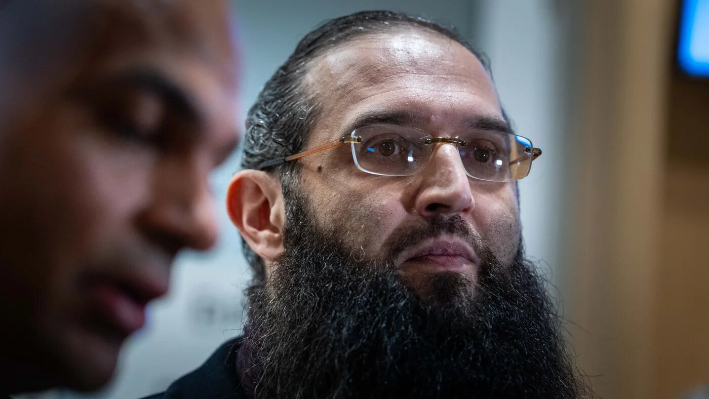 Elias d'Imzalene and his lawyer Rafik Chekkat leave a Paris court after d'Imzalene was tried and sentenced to five months in prison for public incitement to hatred over his call to 'lead the intifada', 19 December 2024 (Alexis Jumeau/ABACA via Reuters Connect)