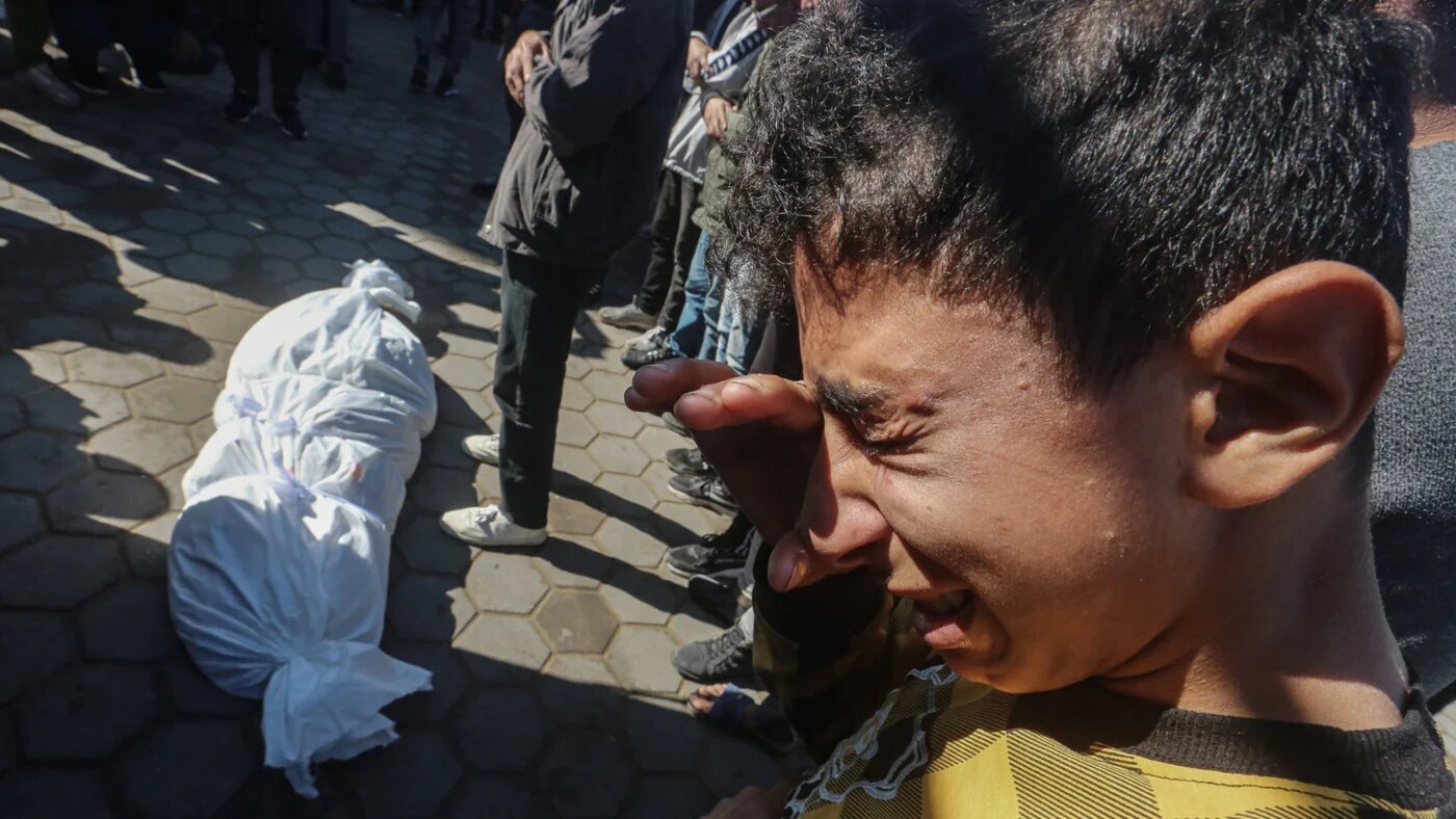 Relatives of Palestinians killed by Israeli forces in Deir al-Balah attend the funeral prayer on 2 January 2025