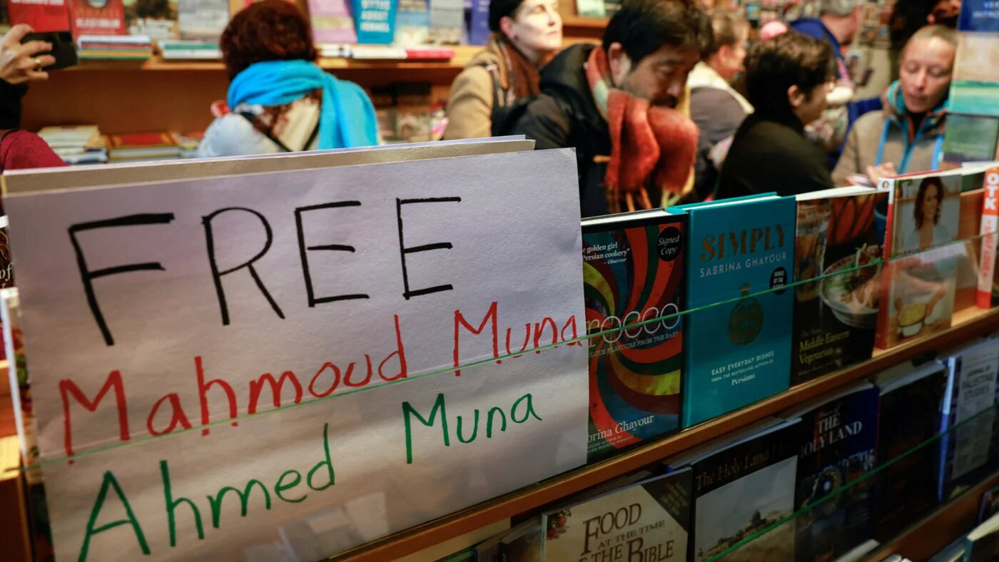 A sign is displayed in support of Mahmoud Muna and Ahmed Muna, as supporters attend an Educational Bookshop, after Israeli police raided two Educational Bookshops and made arrests, in East Jerusalem, 10 February 2025 (Reuters/Ammar Awad)