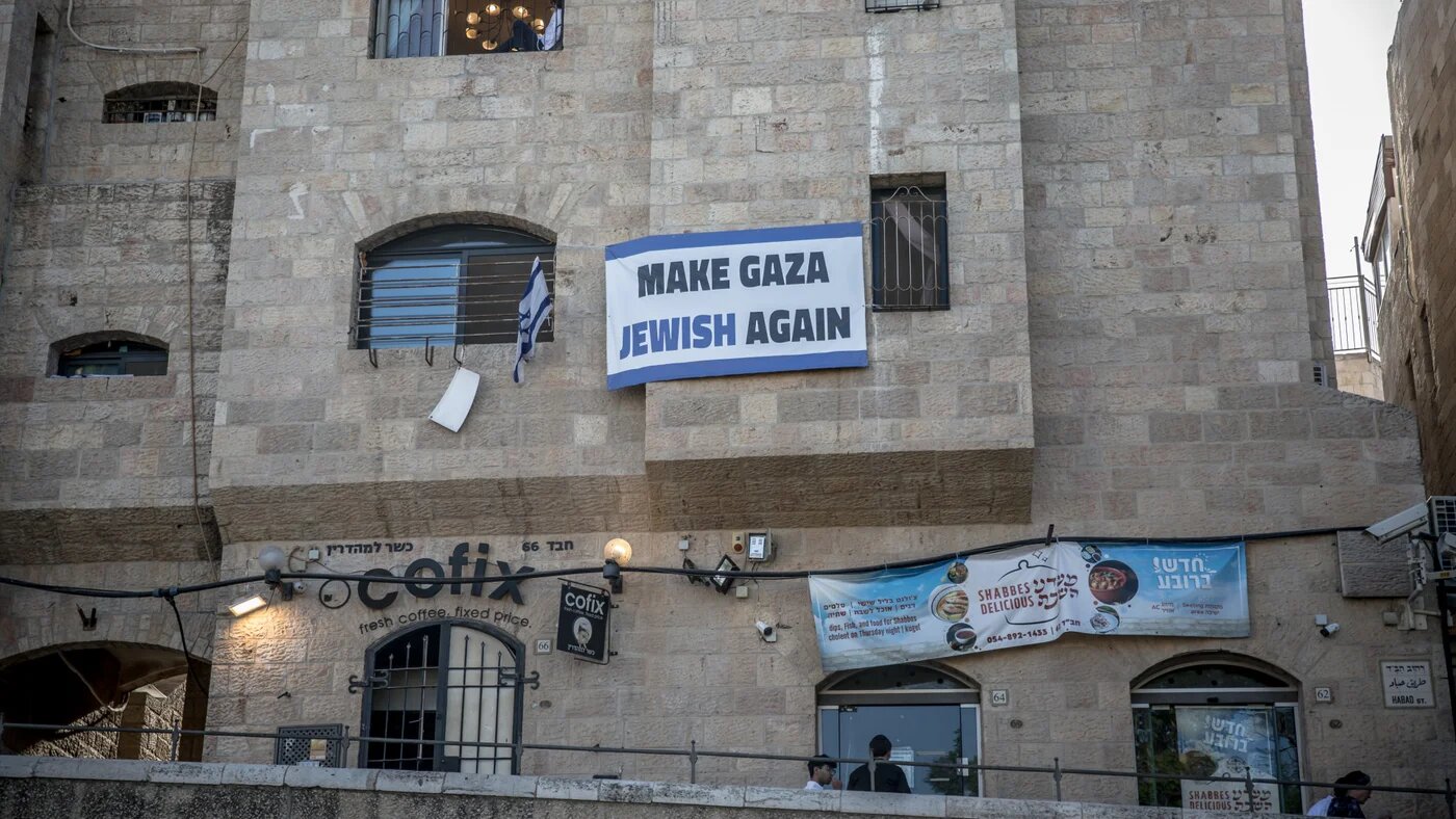 A banner reading 'Make Gaza Jewish Again' hangs from a Jewish settlement building in occupied East Jerusalem's Old City on 12 July 2025, weeks before the Israeli government approved plans to take over Gaza City (Sally Hayden/SOPA Images via Reuters Connect)